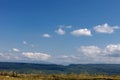 Summer mountains green grass and blue sky with clouds. Royalty Free Stock Photo