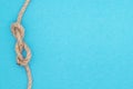 Summer nautical composition, bright background with rope nodal knot