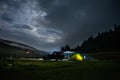 Cozy Camp Tourist In Mountains. Tent and overlanding 4x4 vehicle Royalty Free Stock Photo