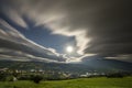 Summer night mountain panorama. Green grassy mountain clearing, spruce trees on blue evening sky copy space background, bright Royalty Free Stock Photo