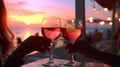 glass of wine in hand on evening pink sunset summer beach restaurant beach , romantic couple silhouette