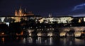 Summer night view of Charles Bridge over the Vltava in the historical part of Prague Royalty Free Stock Photo