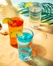 Summer non alcoholic cocktails in colorful glasses on beach with white sand. Summer sea ocean vacation and travel concept. Beach Royalty Free Stock Photo