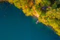 Summer Aerial Oasis: Gazing Down on the Clear Azure Waters of a Peaceful Forest Lake