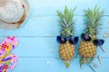 Summer objects of pineapple with sunglasses summer accessory on blue wooden background Royalty Free Stock Photo