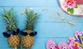 Summer objects of pineapple with sunglasses summer accessory on blue wooden background Royalty Free Stock Photo