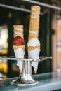 Summer offer ice cream cones in metal hygienic holder on counter at store one