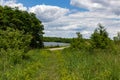 Summer in Omaha, Lake water, path, trail, green vegetation of Ed Zorinsky lake park, Omaha, Nebraska