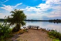 Summer in Omaha, Panorama Shoreline and sky reflections in the lake at Ed Zorinsky Lake Park Omaha NE Royalty Free Stock Photo