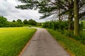 Summer in Omaha, Paved trail with a bench at a bend at Ed Zorinsky lake park, Omaha, Nebraska