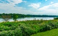 Summer in Omaha, Two boaters canoers in kayaks with Shoreline and sky reflections in the lake at Ed Zorinsky Lake Park Omaha NE Royalty Free Stock Photo