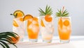 Summer orange cocktails with citrus fruits on white background. Hard seltzer, lemonade, refreshing drinks Royalty Free Stock Photo