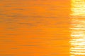 Summer orange natural background. Quiet beautiful golden sunset on the sea Royalty Free Stock Photo
