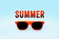 Summer orange text message and orange sunglasses isolated in gradient pastel blue large background