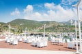 Summer outdoor cafes overlooking the harbor and the mountains, Turkey