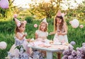 Summer outdoor kids birthday party. Group of happy Children celebrating birthday in park. Royalty Free Stock Photo