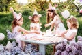 Summer outdoor kids birthday party. Group of happy Children celebrating birthday in park. Royalty Free Stock Photo