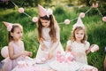 Summer outdoor kids birthday party. Group of happy Children celebrating birthday in park. Royalty Free Stock Photo