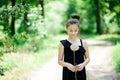 Summer outdoor portrait of a romantic girl with a big fluffy dandelion. the child holds a dry dandelion in his hands Royalty Free Stock Photo