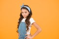 Summer outfit concept. Girl long curly hair. Fashion trend. Little fashionista. Happy childhood. Modern teen clothing