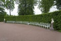 Summer Park with white benches and footpaths.