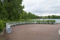 Summer Park with white benches and footpaths.