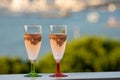 Summer party, drinking of French champagne rose sparkling wine in glasses with view on fishermen harbour of Toulon, France