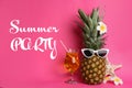 Summer party. Funny pineapple with cocktail, plumeria flowers and starfish on pink background Royalty Free Stock Photo