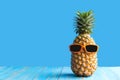 Summer in the party.  Hipster Pineapple Fashion in sunglass bright beautiful color in holiday, Creative art fruit for tropical sty Royalty Free Stock Photo