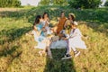 Summer party, Outdoor Gathering with friends. Five young women, Friends at the picnic dancing and having fun on summer Royalty Free Stock Photo