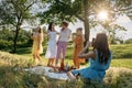 Summer party, Outdoor Gathering with friends. Five young women, Friends at the picnic dancing and having fun on summer Royalty Free Stock Photo