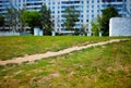 Summer path to blurred second-hand realty architecture