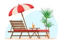 Summer patio furniture. Deck chair with wooden table and beach umbrella for holiday. Royalty Free Stock Photo