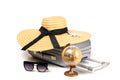 Summer pattern background. Suitcase, sunglasses with toy plane, straw hat and globe in travel composition isolated on Royalty Free Stock Photo