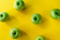 Group of green apples on yellow background Royalty Free Stock Photo