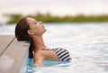 Summer, peace and woman relax in swimming pool on luxury holiday or vacation at hotel or villa in Cancun. Person Royalty Free Stock Photo