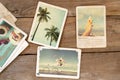 Summer photo album on wood table. Royalty Free Stock Photo