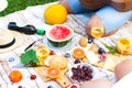 Summer Picnic Basket on the Green Grass. Food and drink concept.