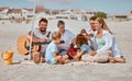 Summer, picnic and family with guitar at beach enjoying holiday, weekend and vacation on Miami beach. Love, bonding and Royalty Free Stock Photo