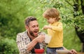 summer picnic. Morning breakfast. family dinner time. happy fathers day. Little boy with dad eat cereal. healthy food Royalty Free Stock Photo