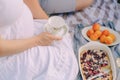 summer picnic in the nature of a pregnant woman, healthy food for pregnant women Royalty Free Stock Photo