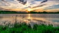 Picture with beautiful colorful sunset over the lake, a wonderful place of strength and energy, peace, harmony and quiet Royalty Free Stock Photo