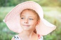 Summer portrait of a beautiful girl in a pink hat. Royalty Free Stock Photo