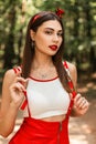 Summer portrait beautiful pretty young woman with red lipstick and sexy lips in white youth top in red fashionable sundress in