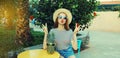 Summer portrait beautiful young woman with pineapple fruits posing in city park Royalty Free Stock Photo