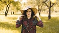 Summer portrait, beautiful young woman wearing straw hat at sunset time Royalty Free Stock Photo