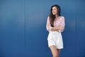 Summer portrait of a cheerful beautiful woman outdoors on a sunny day