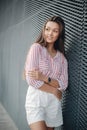 Summer portrait of a cheerful beautiful woman outdoors on a sunny day