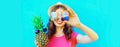Summer portrait close up of happy smiling woman with pineapple taking selfie by smartphone wearing straw hat, sunglasses on blue Royalty Free Stock Photo