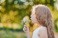 Summer portrait of girl with big dandelion. Royalty Free Stock Photo